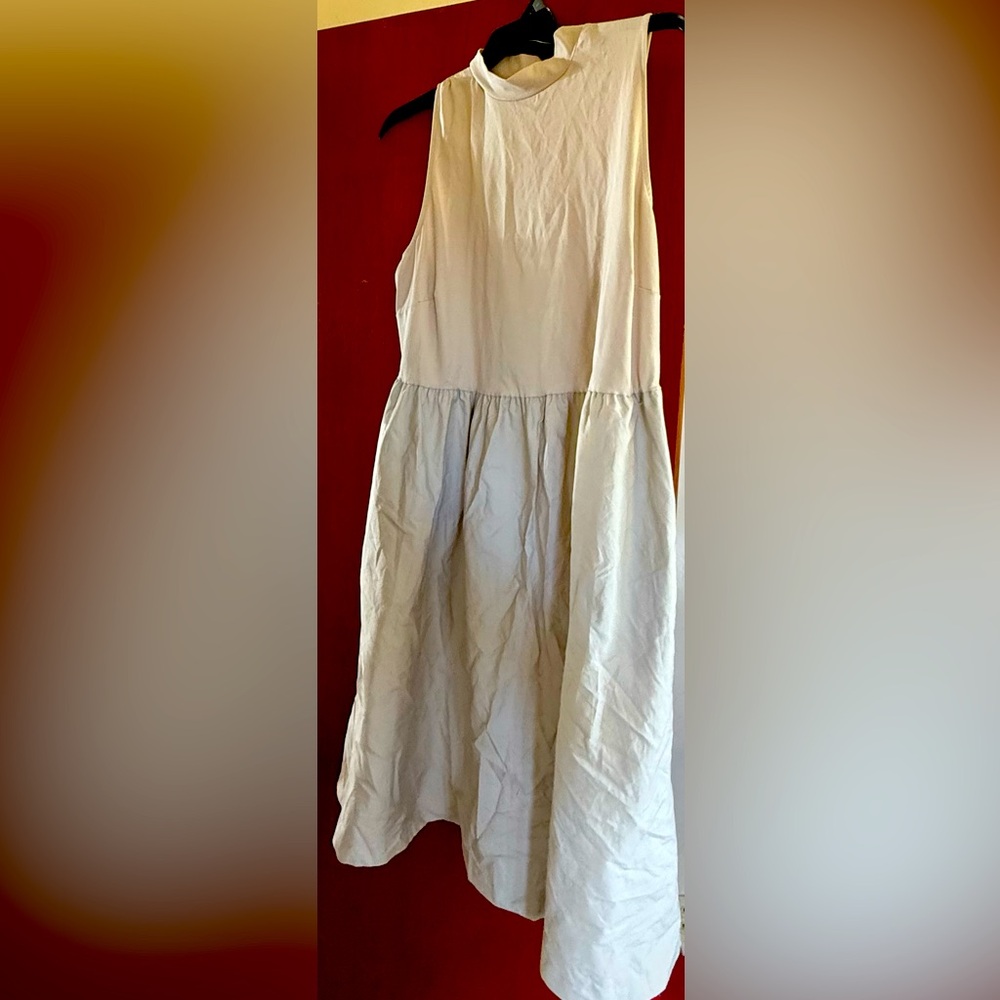 Elegant cream colored Sleeveless Dress